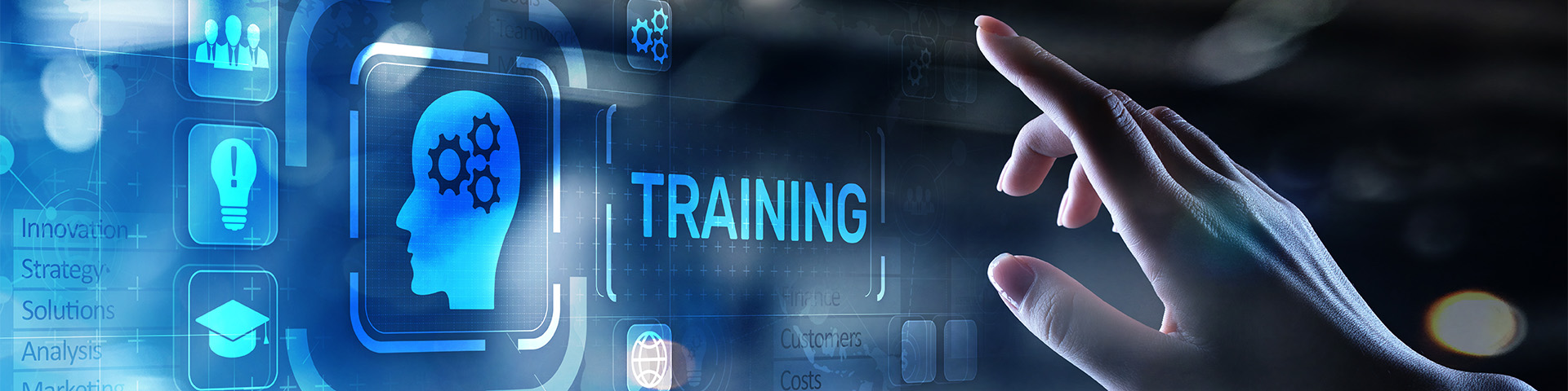 a hand hovers over various icons and the word training on a screen