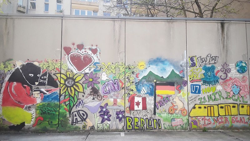 A wall in Berlin tagged with graffiti.