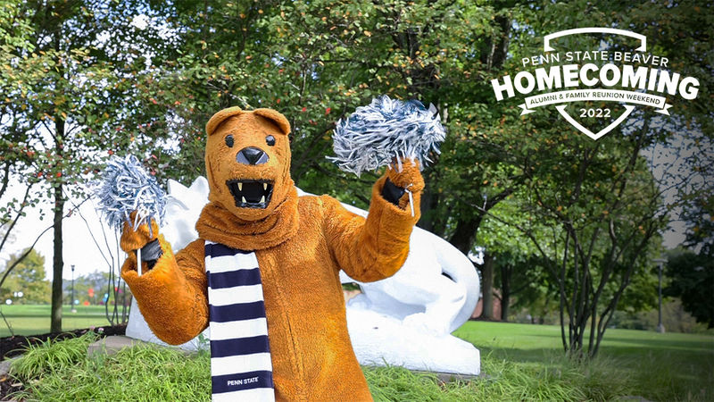 Lion shakes pom poms at the Lion Shrine. Text says Penn State Beaver Homecoming alumni and family reunion weekend 2022.