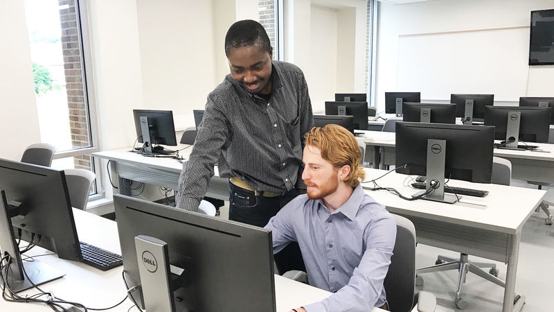 Richard Lomotey and Evan McStay in a computer lab