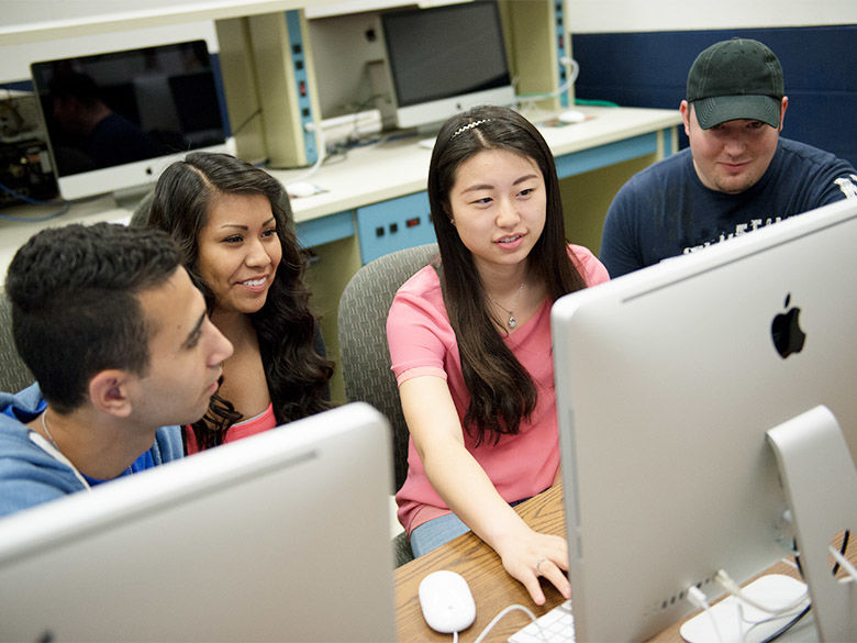 Four students in a computer lab