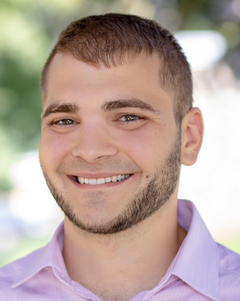 A photo of Matt Caputo. He is smiling.
