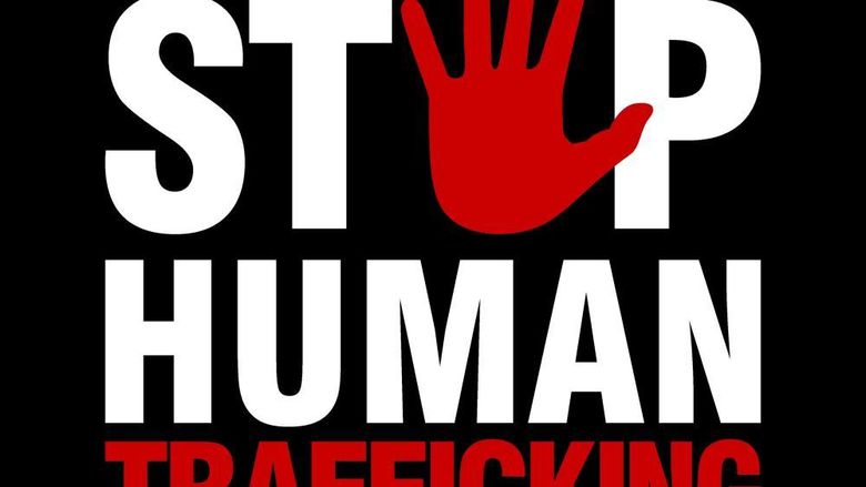 A black background with the words stop human trafficking in white and red and the image of a red handprint