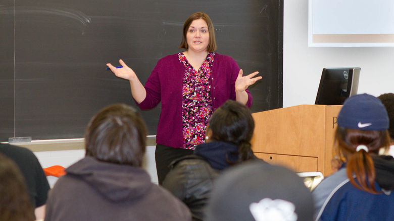 Associate Professor Mari Pierce lectures to a class.