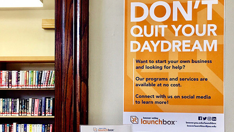 A photo of a LaunchBox poster that says Don't Quit Your Daydream