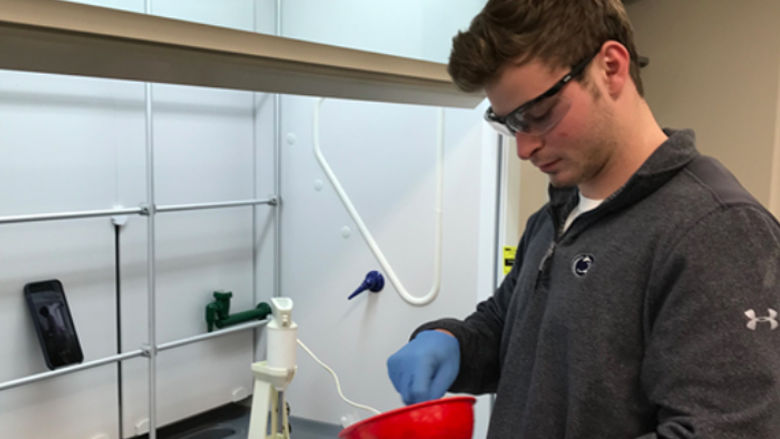 A student at works on a project in a lab.