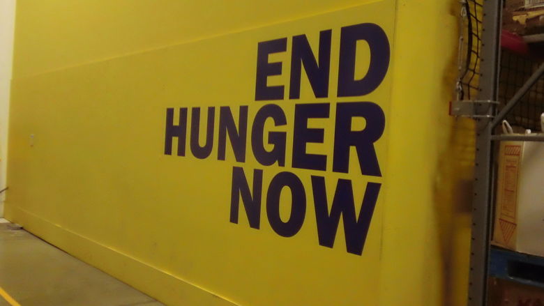 Shot of a wall at the Greater Pittsburgh Community Food Bank that reads "End Hunger Now."