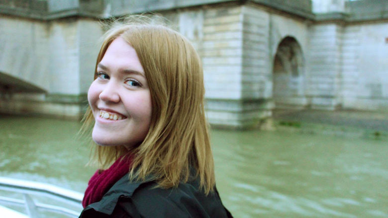 Katie Work sits in a boat on the Seine River.