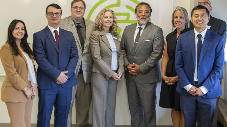 Group photo of Penn State representatives posing with the National Cyber Director Harry Coker, Jr.