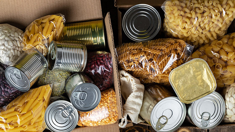A picture of pasta and canned foods in a box