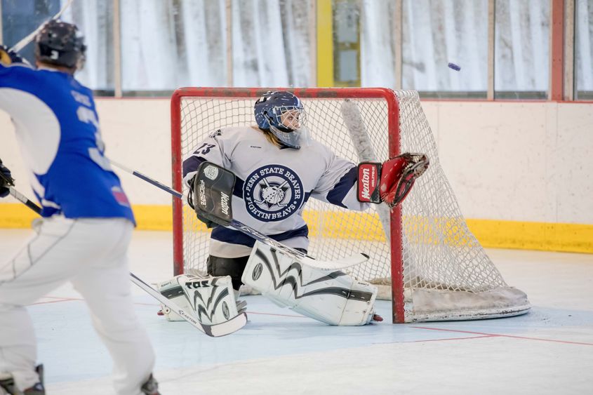 Goalie Katie work watches as the puck careens off her glove.