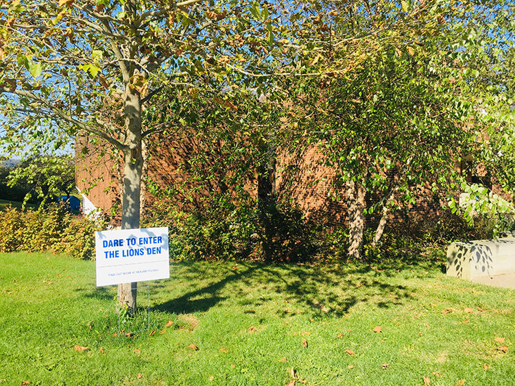 A sign on the Penn State Beaver campus advertises the Lion's Den competition