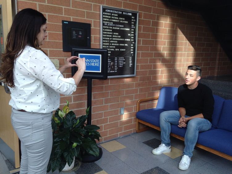 Lecturer Hilary O'Toole records video of student Emir Erisen talking.