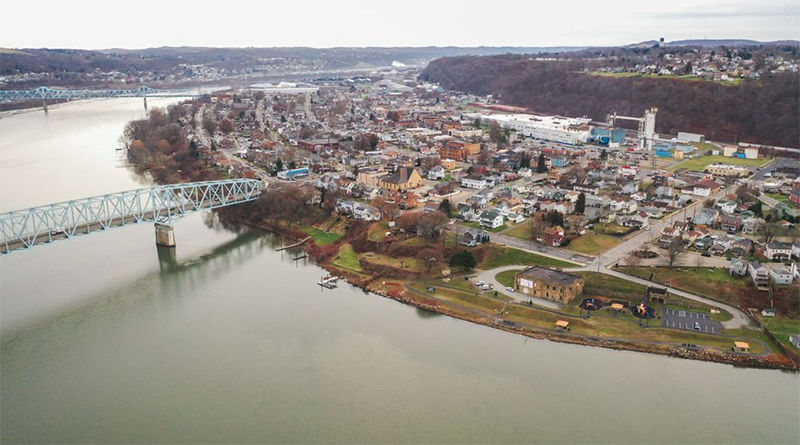 An aerial view of Beaver County with a river bending in the left of the photograph, a bridge, and a town to the right