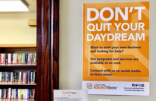 A photo of a LaunchBox poster that says Don't Quit Your Daydream